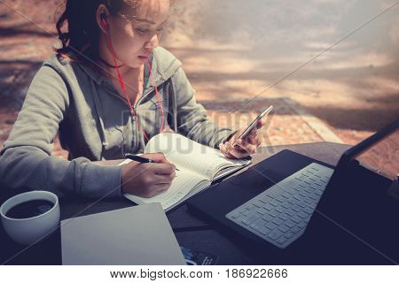 Woman working in a natural garden on vacation.