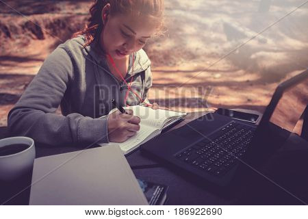 Woman working in a natural garden on vacation.