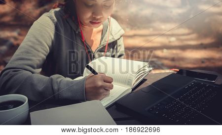 Woman working in a natural garden on vacation.