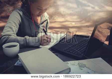 Woman working in a natural garden on vacation.