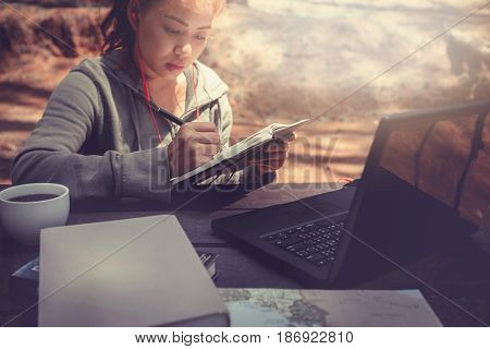 Woman working in a natural garden on vacation.