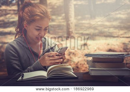 Woman working in a natural garden on vacation.