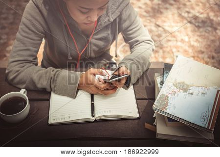 Woman working in a natural garden on vacation.