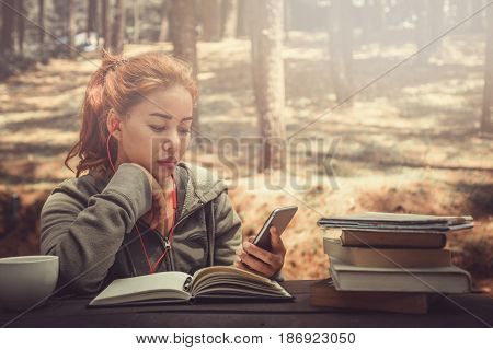 Woman working in a natural garden on vacation.