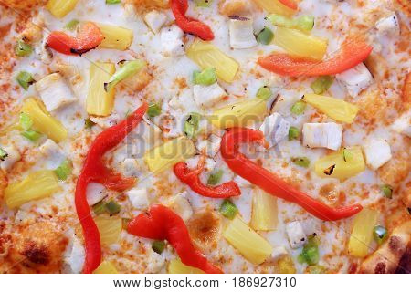 Pizza. Hawaiian Pizza with Pineapple, Bell Peppers, Ham and Bacon bits. Isolated on white. Room for text.