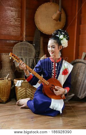 NAKORN PHANOM THAILAND - FEBRUARY 14 2015: Thai northeastern Phutai musician with traditional music equipment in Phutai world event day in Renunakorn of Nakorn Phanom Thailand.