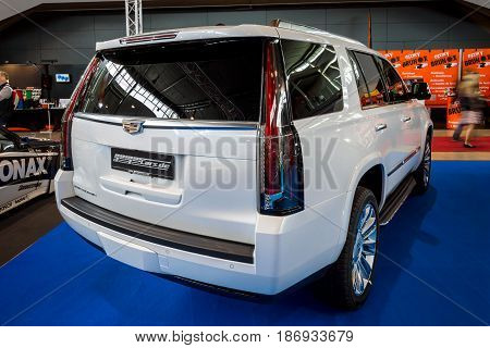 STUTTGART GERMANY - MARCH 03 2017: Full-size luxury SUV Cadillac Escalade Platinum 2017. Rear view. Europe's greatest classic car exhibition 