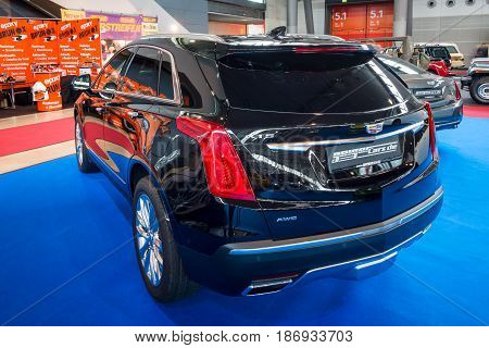 STUTTGART GERMANY - MARCH 03 2017: Mid-size luxury crossover SUV Cadillac XT5 Platinum 2017. Rear view. Europe's greatest classic car exhibition 