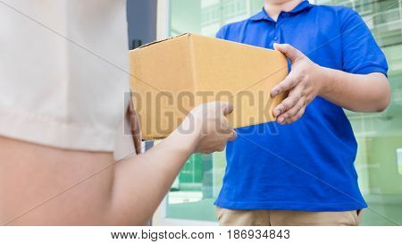 Postal - Delivery Of A Package Through A  Service; Woman Customer Hand Accepting Receipt Cardboard B