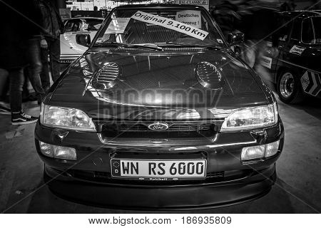 STUTTGART GERMANY - MARCH 03 2017: Rally special car Ford Escort RS Cosworth 1993. Black and white. Europe's greatest classic car exhibition 
