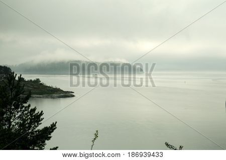 Fogg on the sea coast, island and land