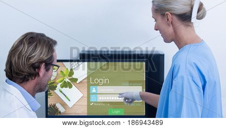 Digital composite of Medical staff looking at signup page on monitor