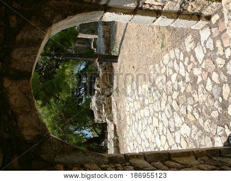 stony arch and cobbled path of the fortress