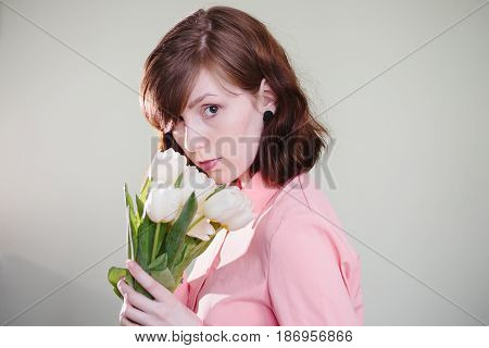 Girl holding tulips. Beauty, pink and tenderness