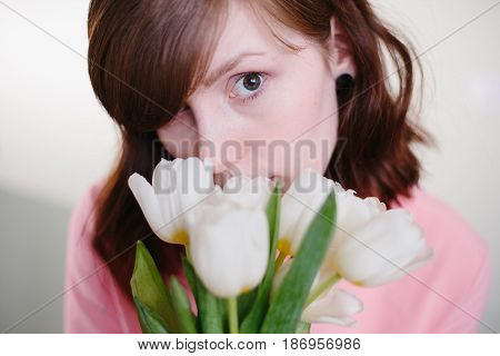 Girl holding tulips. Beauty, pink and tenderness