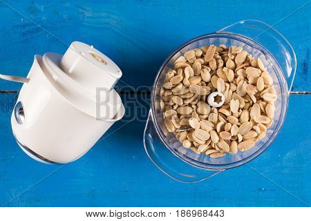 Blanched Peanuts In The Blender In Flat Lay Above Blue Wooden Ba