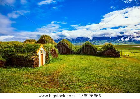 Ethnographic Museum-estate Glaumbaer, Iceland. The picturesque village of old houses covered with turf and grass. The concept of the cultural and historical tourism