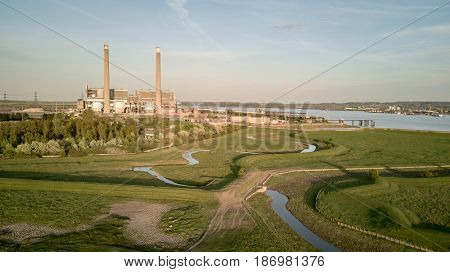 An aerial view of the decommissioned Tilbury A and B fossil fuel power stations located on the banks of the River Thames in Essex England.