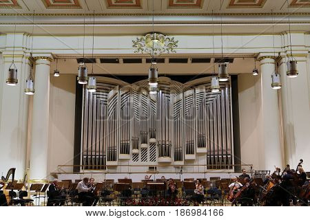 CRACOW POLAND - SEPTEMBER 25 2015: View of the stage of the concert hall at the Cracow Philharmonic with the new Orgelbau organ in the background. Cracow Poland