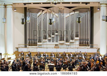 CRACOW POLAND - SEPTEMBER 25 2015: View of the stage of the concert hall at the Cracow Philharmonic with the new Orgelbau organ in the background. Cracow Poland