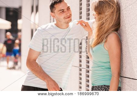 Man Flirting With Girl On City Street