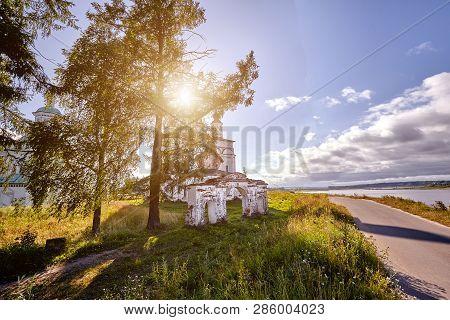 Old Orthodox Church At Village. Summer View With Floral Meadow. Sun Flare