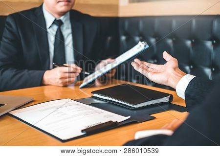 Job Interview Concept , Senior Manager Reading A Resume During A Job Interview Employee Young Man Me