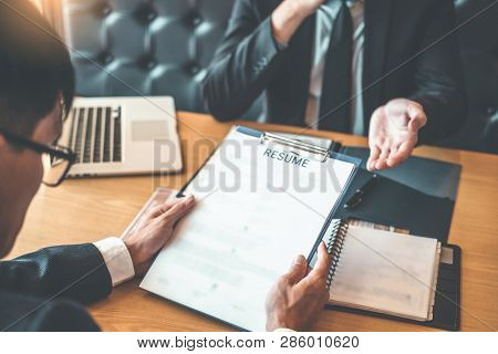 Job Interview Concept , Senior Manager Reading A Resume During A Job Interview Employee Young Man Me