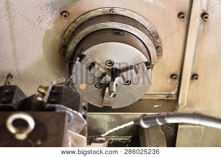 Spindle Chuck And Installed Metal Part On High Precision Cnc Industrial Lathe Turning Machine. Close