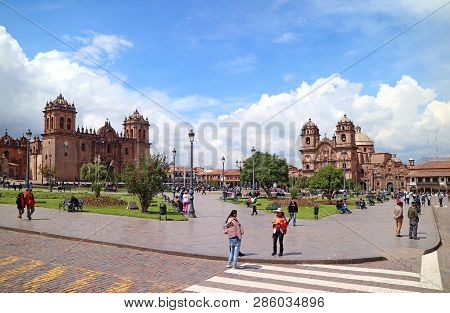 Many Tourist At Plaza De Armas Square With Cusco Cathedral And Thechurch Of Iglesia De La Compania D