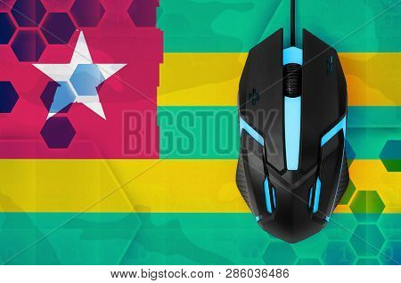 Togo Flag  And Computer Mouse. Concept Of Country Representing E-sports Team