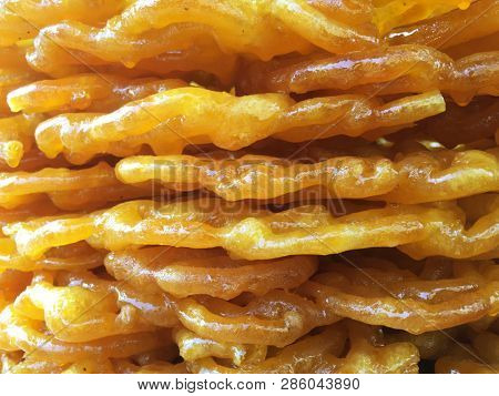 Extreme close up of heap of deep fried Jalebi- a popular Indian sweet.