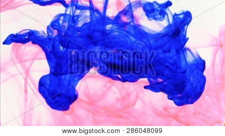 Red And Blue Ink That Enters The Water Forming Animated Textures, Footage Ideal For Motiongraphic An
