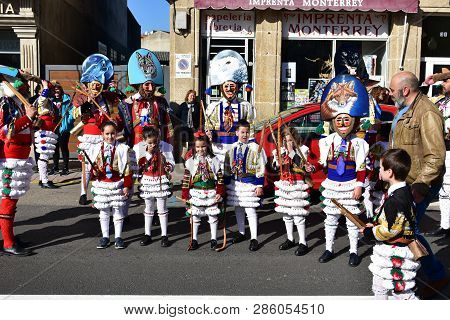 Verin, Spain, 24 Feb 2019. Famous Carnival And Street Parade With Cigarrons Costumes. Ourense Provin