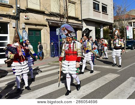 Verin, Spain, 24 Feb 2019. Famous Carnival And Street Parade With Cigarrons Costumes. Ourense Provin