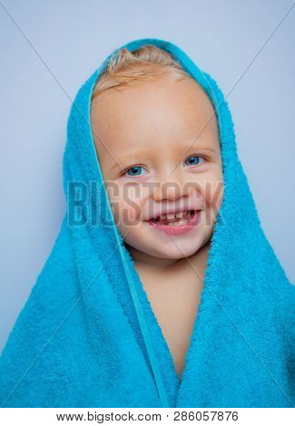 Adorable Baby Under A Hooded Towel After Bath. Bubble Bath Time. Happy Bath Time