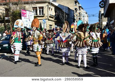 Verin, Spain, 24 Feb 2019. Famous Carnival And Street Parade With Cigarrons Costumes. Ourense Provin