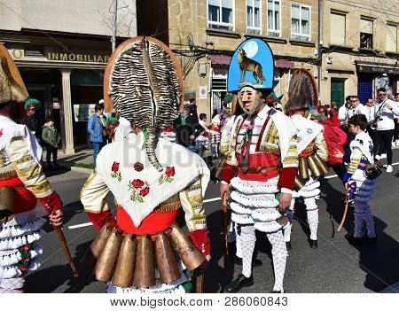Verin, Spain, 24 Feb 2019. Famous Carnival And Street Parade With Cigarrons Costumes. Ourense Provin