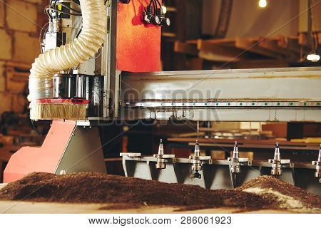 Machine With Numerical Control For Cutting Wood With Various Router Bits.