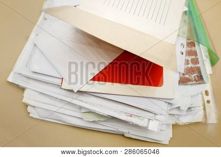 Heap Of Old Papers In Folders On A Desk, Studio Closeup