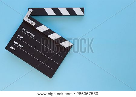 Black Clapperboard Isolated On Color Background, Flat Lay