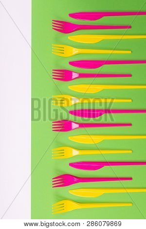 Many Color Plastic Cutlers On A Bright Background