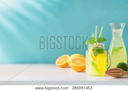 Lemonade In Mason Jar With Lemon And Mint On Blue. Copy Space.