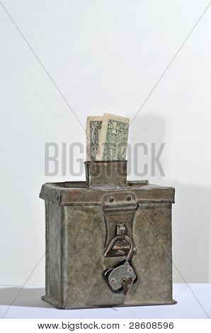 old steel money box with padlock and dollar