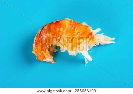 An Unskin Lobster On A Blue Background