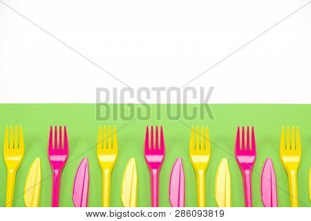 Many Color Plastic Cutlers On A Bright Background
