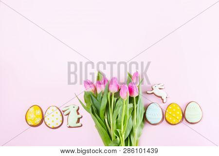 Easter Handmade Cookies Row With Fresh Tulip Flowers Bouquet On Pink Background, Top View Flt Lay Sc