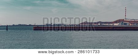 Harbor In Island Helgoland, Germany, Nordic Style Houses With Boat And Blue Sky, Panorama View From 