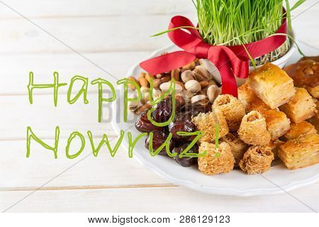 Nowruz Holiday Concept - Grass, Baklava Sweets, Nuts And Seeds, Copy Space