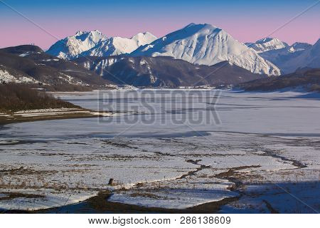 Amazing Sunset Over Frozen Lake Of Campotosto In Abruzzo